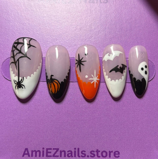 Set of Halloween-themed false nails in a clear case with a purple background, featuring the brand 'AmieEZnails'.